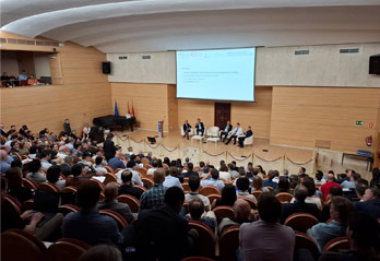Photo of the crowded amphitheater during the conference